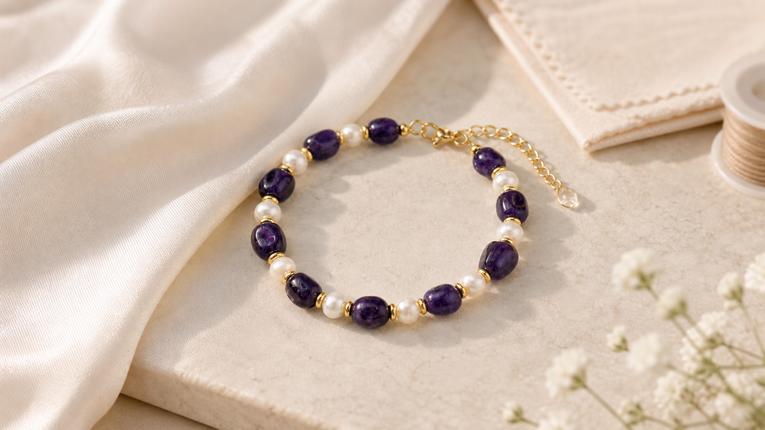 Purple crystal bracelet The Amethyst Drift beside a jewelry care cloth and restringing cord