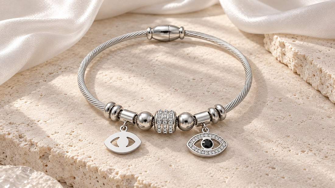 The Argent Veil silver-tone evil eye bracelet with two eye-shaped charms on pale stone and white silk