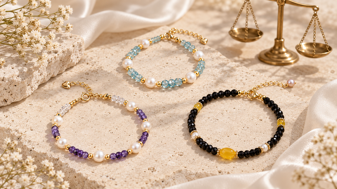 Aquamarine, amethyst, and black obsidian bracelets arranged for a Libra crystal jewelry guide
