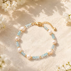 The Aqua Serenity Natural Aquamarine and Freshwater Pearl bracelet for calm and clarity, lifestyle styling image