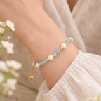 The Aqua Serenity Natural Aquamarine and Freshwater Pearl bracelet for calm and clarity, main product image