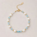 The Aqua Serenity Natural Aquamarine and Freshwater Pearl bracelet for calm and clarity, shown worn on wrist