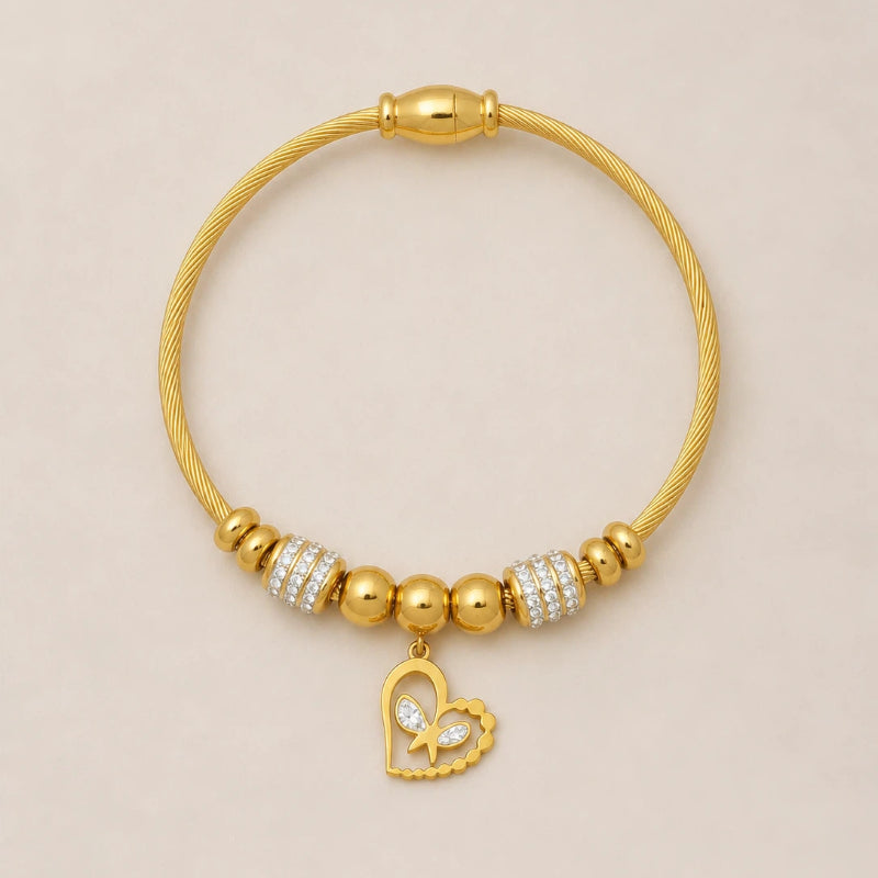 The Amorette Glow gold heart charm bangle for self-love and tender connection, main product image