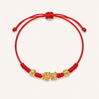 Red string Pixiu bracelet with a gold-tone charm and two engraved beads