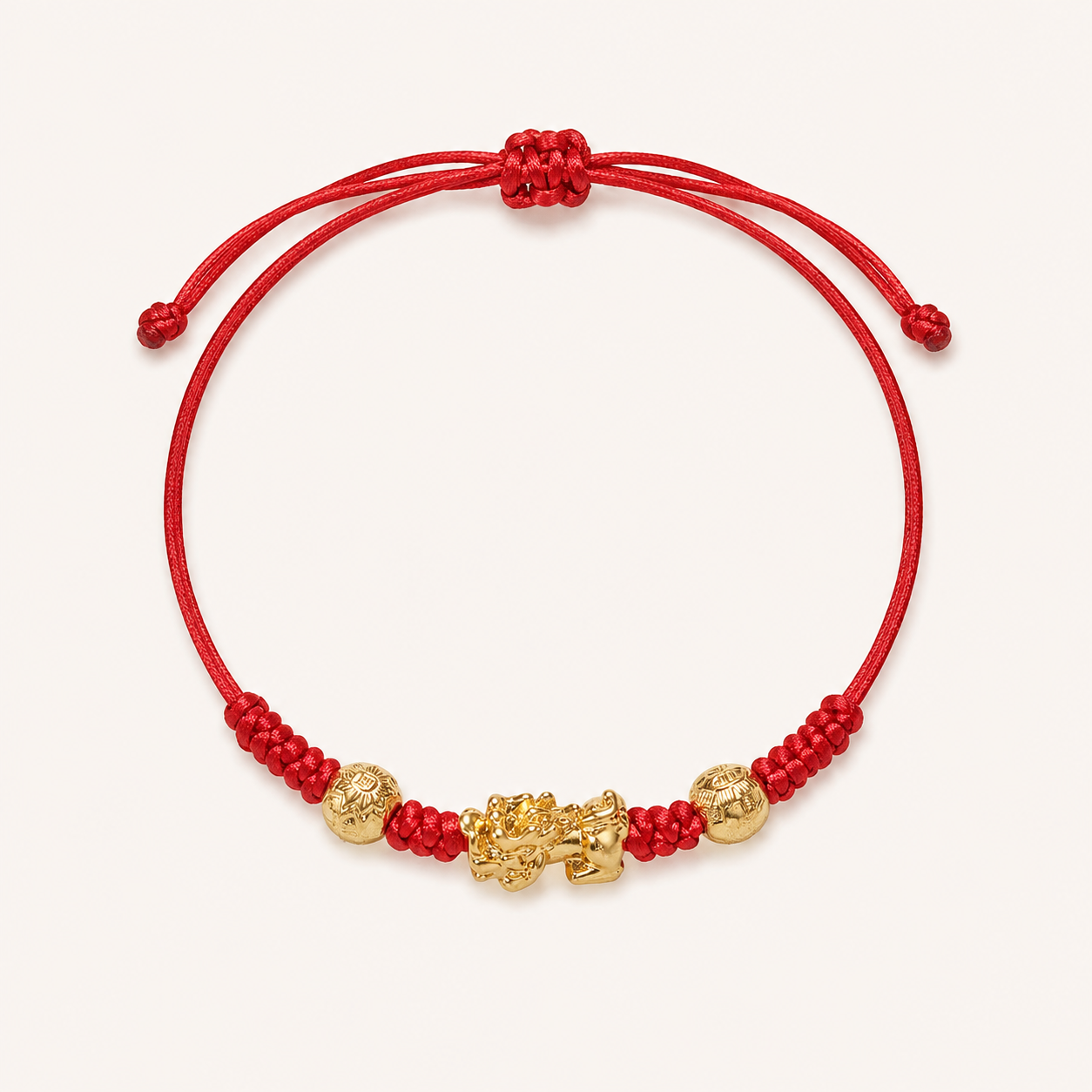 Red string Pixiu bracelet with a gold-tone charm and two engraved beads