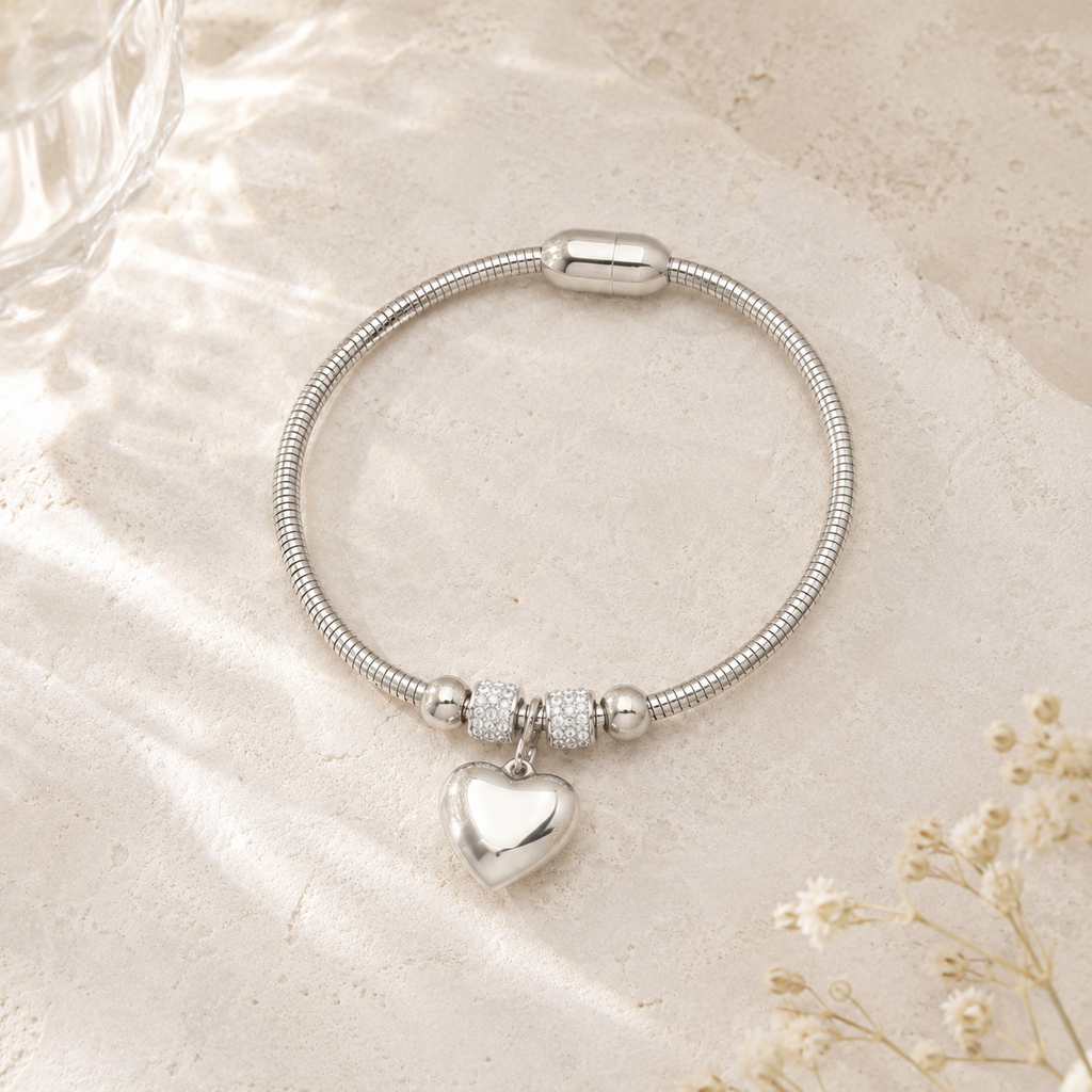 The Lunessa Heart silver-tone heart charm bracelet for self-love and tenderness, close-up detail image